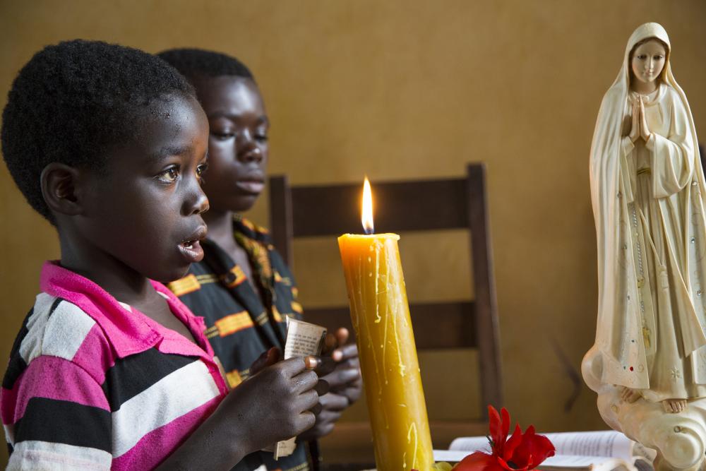 Two children holding candles