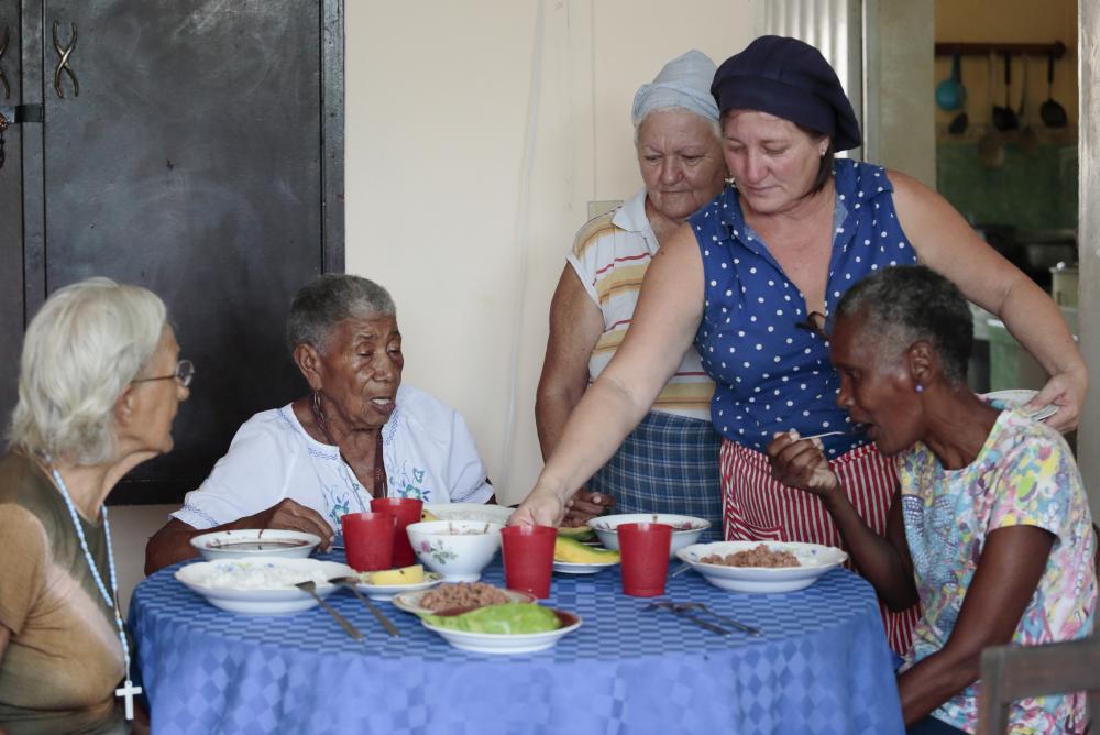 Senior citizens are seen at "Love in Alamar" (Al Amor de Alamar) house where food is served to needed families in this poor neighborhood in Havana, Cuba.