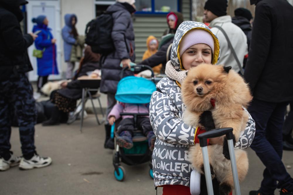 Ukrainian girl with her pet dog.