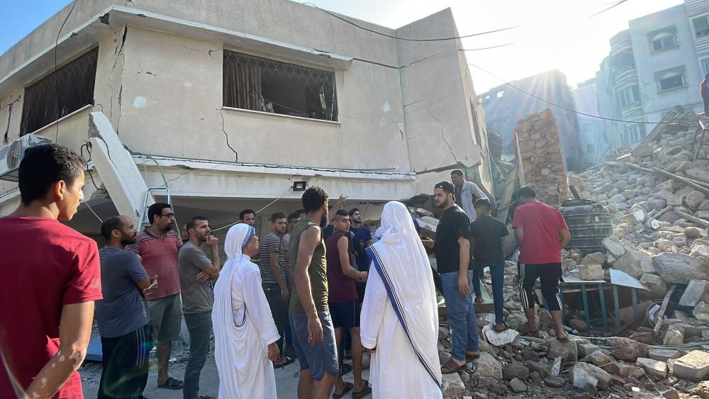 People standing in front of rubble