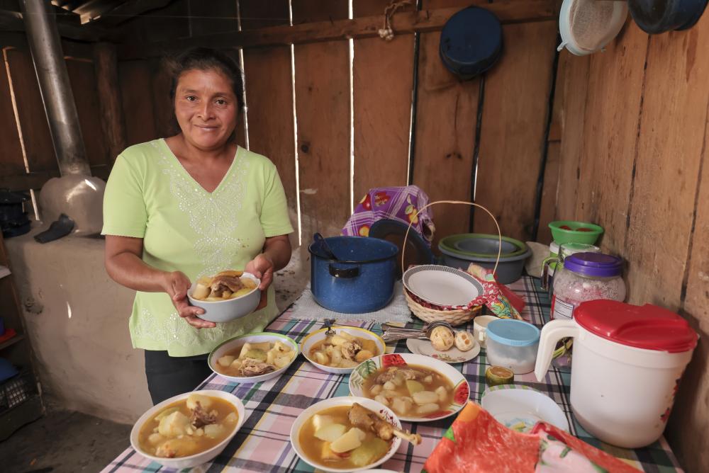 Woman from Honduras makes dinner