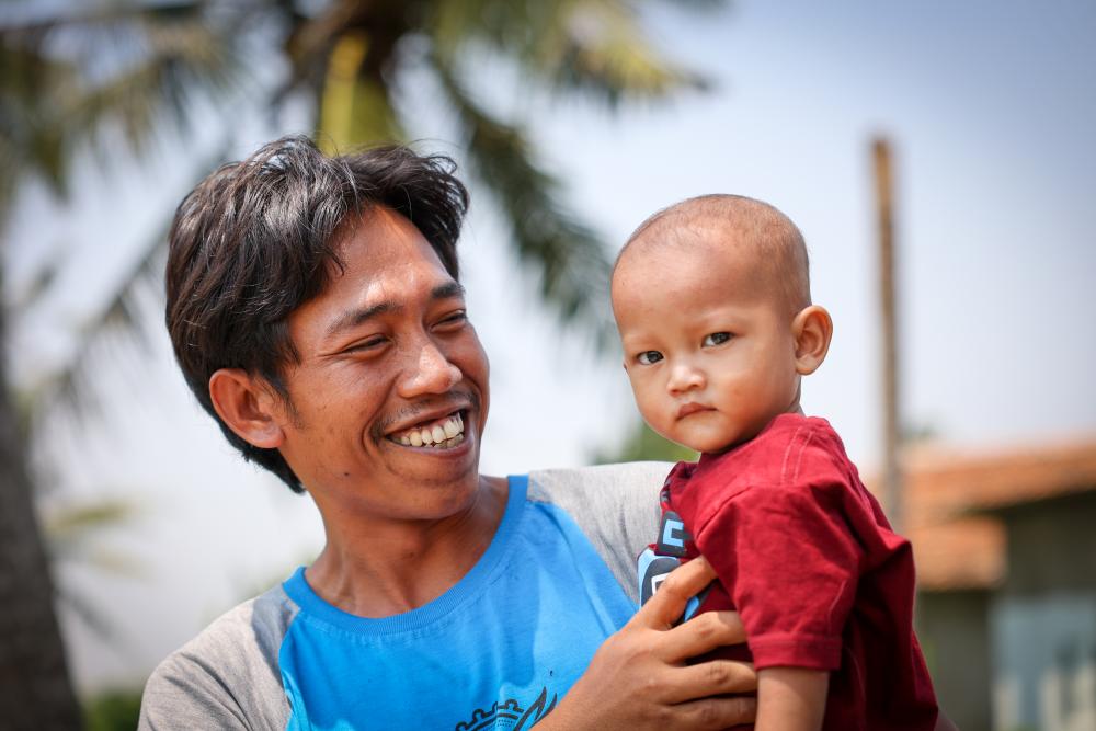 A man holding a baby