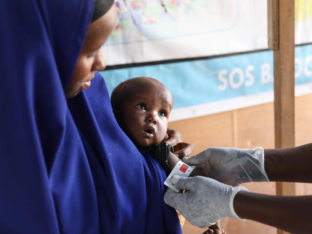 A baby and her mother during a medical check-up