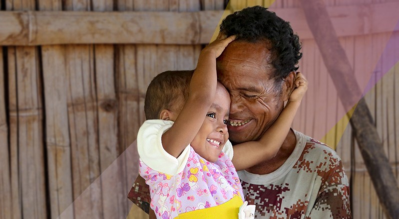 A little girl hugging her father